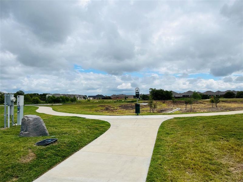 View of community featuring a lawn