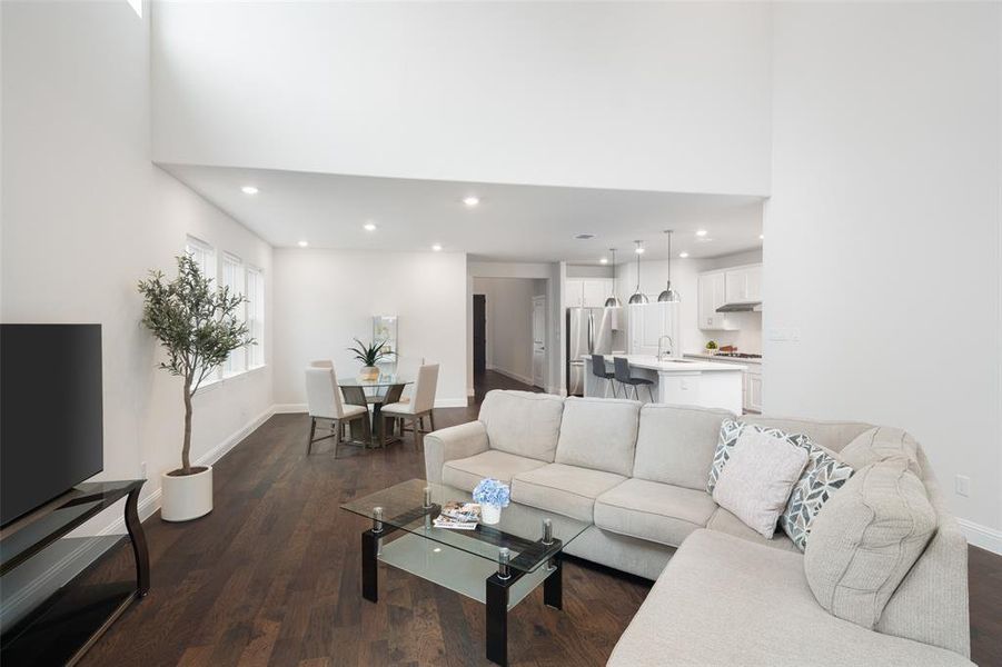 Living room with dark hardwood / wood-style flooring and sink