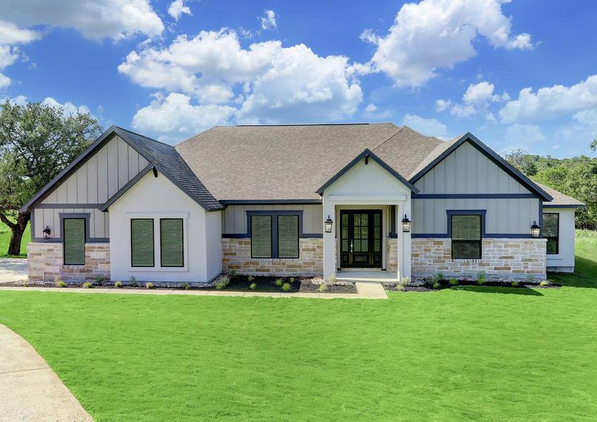 This beautiful home has an exquisite stone, siding and stucco exterior.