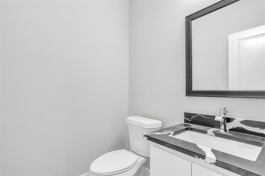 Bathroom with vanity and toilet