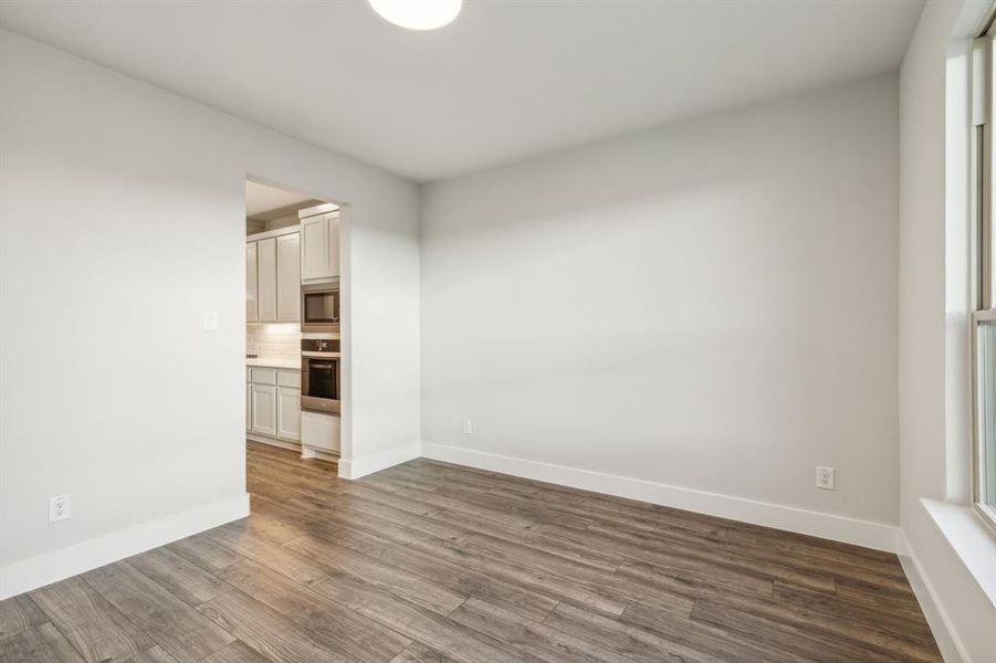 Unfurnished room featuring hardwood / wood-style flooring