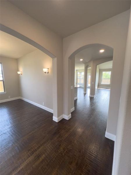 Unfurnished room featuring dark hardwood / wood-style floors