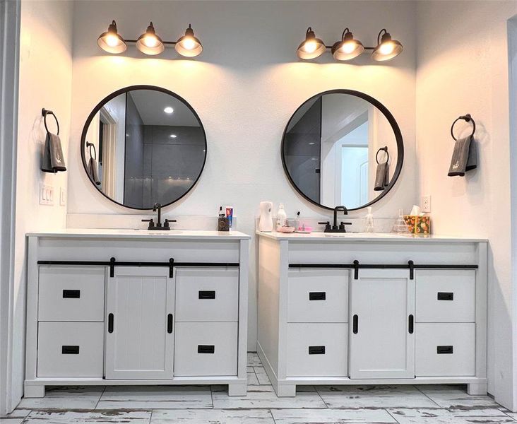 Master Bathroom with tile flooring and double vanity