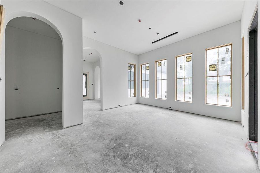 View of your breakfast if you're standing in the kitchen. Butlers pantry is located through the archway. Pantry includes floor to ceiling cabinets as well as a long countertop, sink, second state of the art dishwasher and water filtration system.