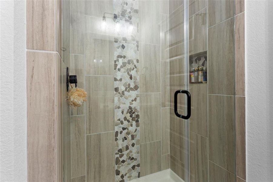 Shower with upgraded tile option and shampoo alcove