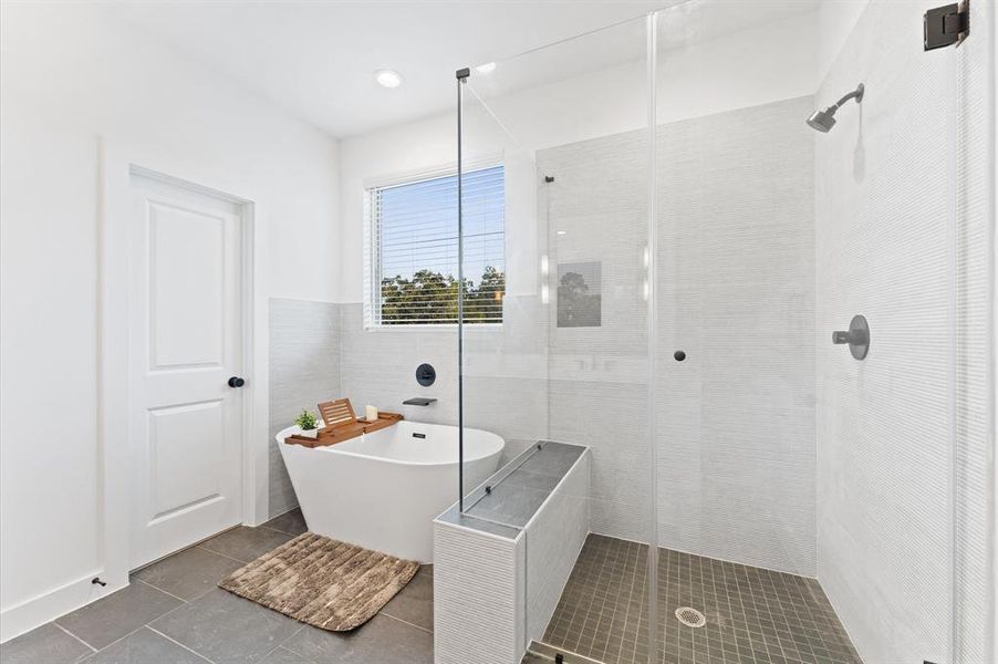 Luxurious primary bath with soaking tub and large walk in shower.