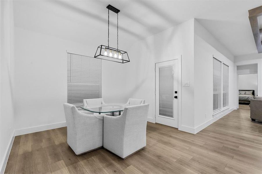 Dining space with light wood-type flooring