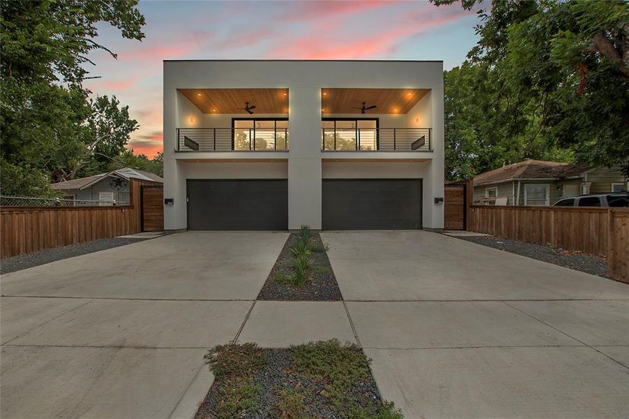 Contemporary home featuring a balcony and a garage