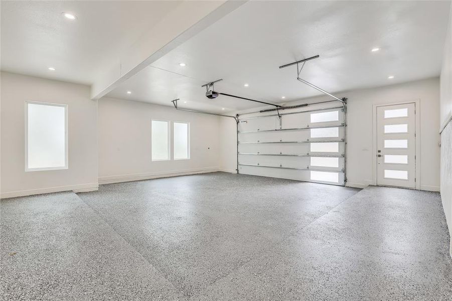 Epoxy type flooring in garage, plus an electric car outlet for easy charging.  Holiday lights have a built in time on the wall that coordinates with outlets in the eaves around the home.