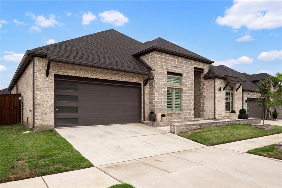 French country home with a garage