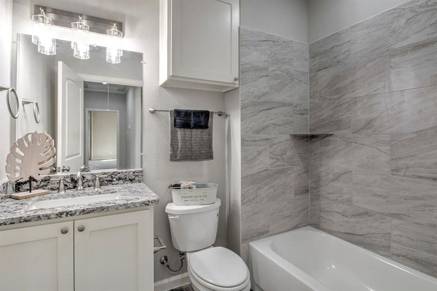 Bathroom featuring vanity and toilet