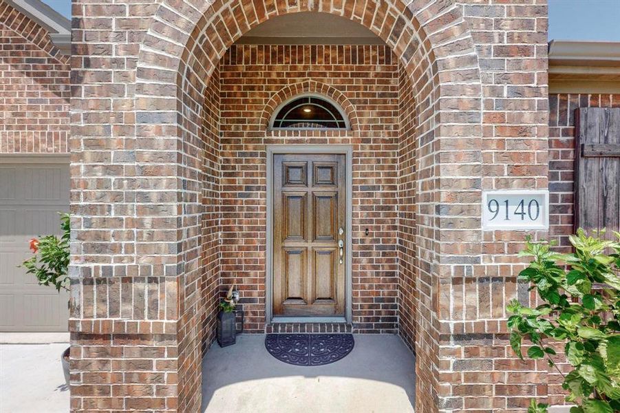 Property entrance featuring a garage