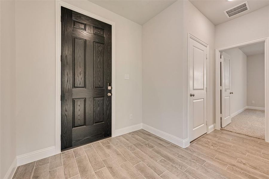 Entryway with light wood-type flooring