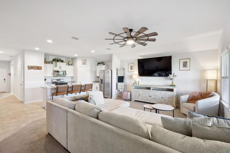 Tiled living room with ceiling fan