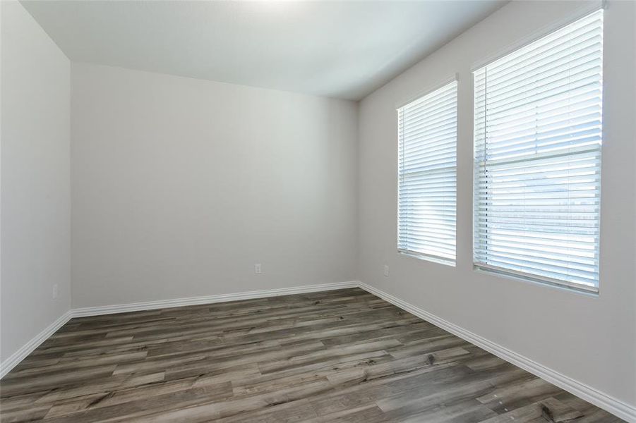 Office in front of home featuring plenty of natural light and luxury vinyl flooring.