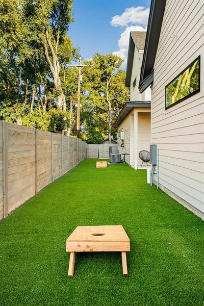 Side yard that is turfed along the side of the casita and main house.