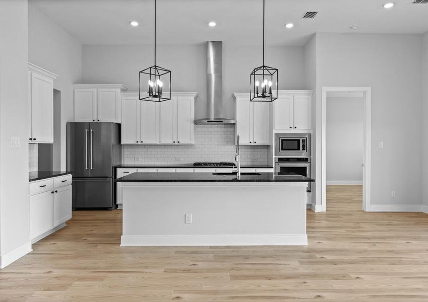 Sprawling kitchen island is located in the kitchen.