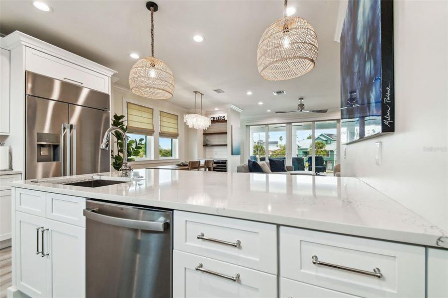 Beautiful kitchen featuring built-in refrigerator, soft-close drawers and cabinets and stainless, upgraded appliances.