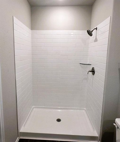 Oversized master shower with ceramic tile walls
