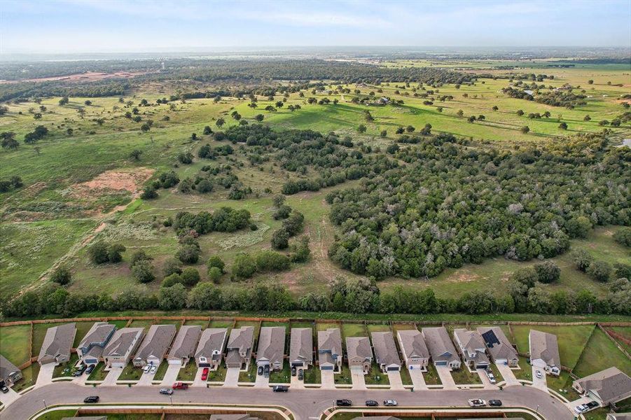 Photos Showing easment with trees behind the home