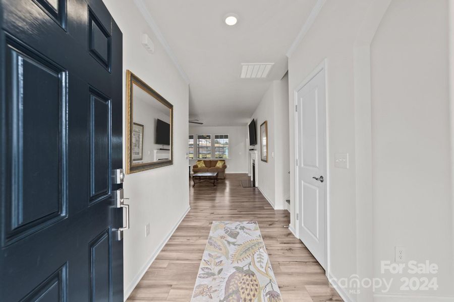 Foyer entry with vinyl plank flooring.  Office/guest bedroom with full bath is immediately to right for convenience and privacy.