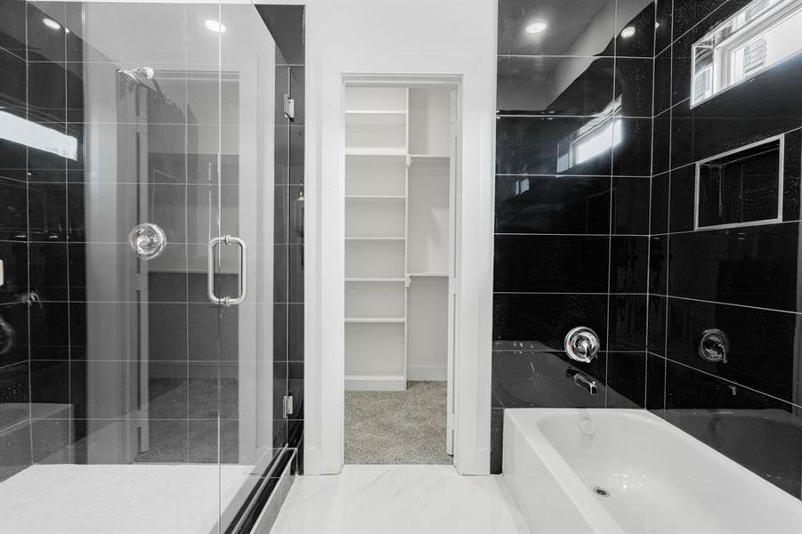 Bathroom featuring separate shower and tub