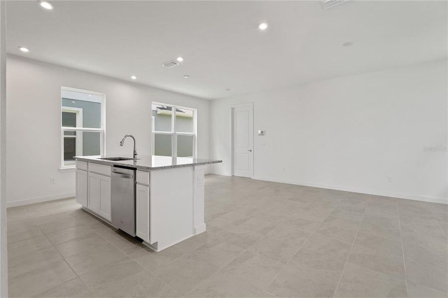 Living area over looking kitchen and dining.