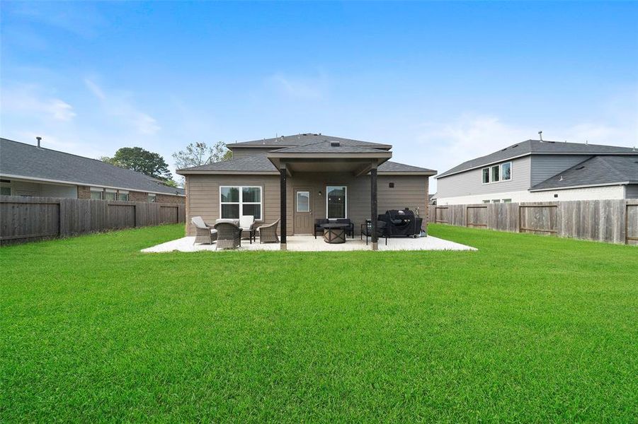 Lots of space in this backyard to play!  This home is perfect for both indoor and outdoor entertaining and play.