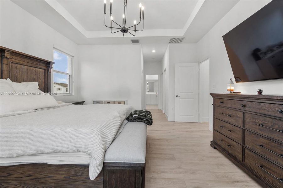 Primary Bedroom with Two Walk-In Closets and Bathroom Suite