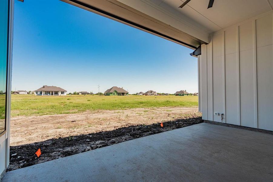 Example of builders View of patio featuring ceiling fan