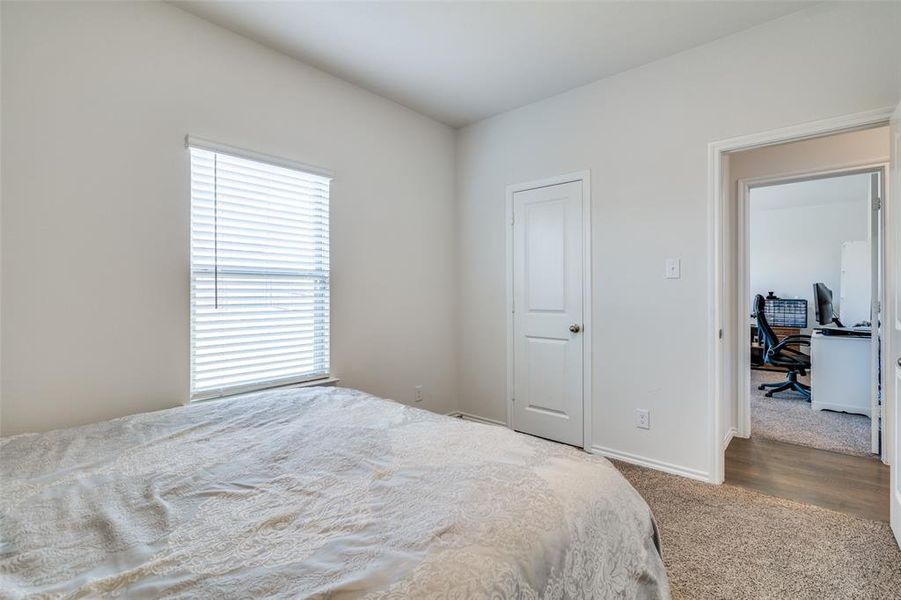 Bedroom with hardwood / wood-style flooring