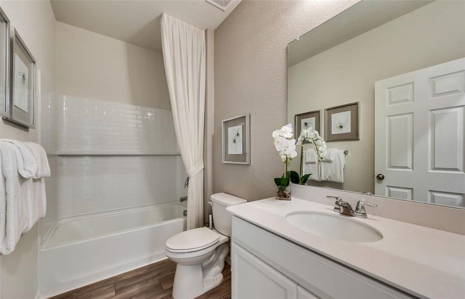 Upgraded secondary bath with elegant finishes *Real Home pictured, former model.