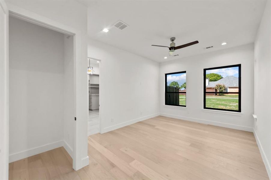 Master Bedroom featuring light hardwood / wood-style floors and ceiling fan