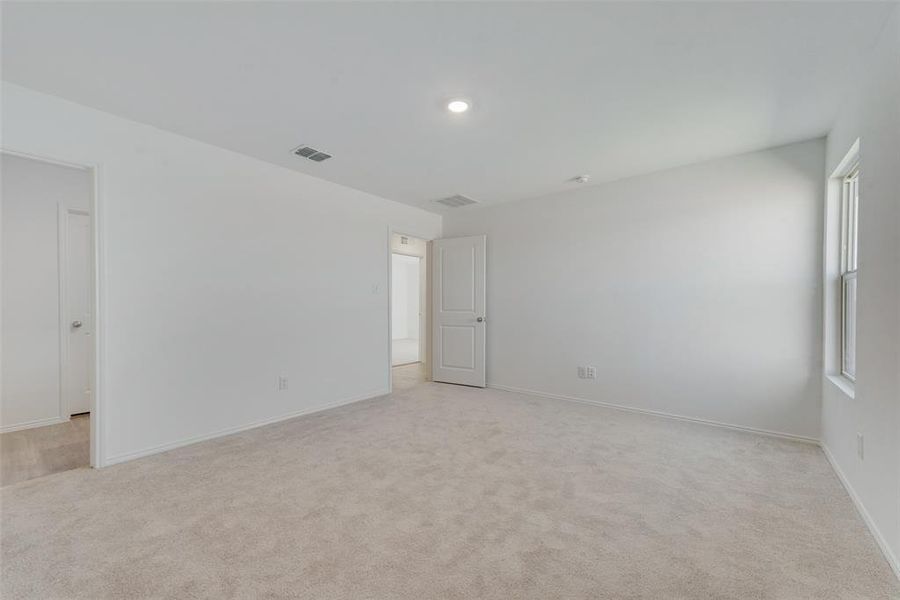 Unfurnished room with light carpet