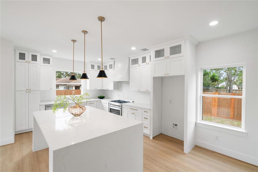 Quartz Counter Tops and island showcasing the waterfall edge