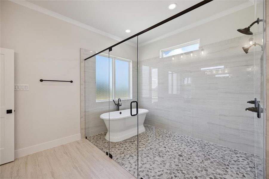 Bathroom featuring walk in shower, tile patterned flooring, a healthy amount of sunlight, and ornamental molding