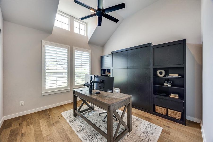 Office area featuring  vaulted ceiling and ceiling fan