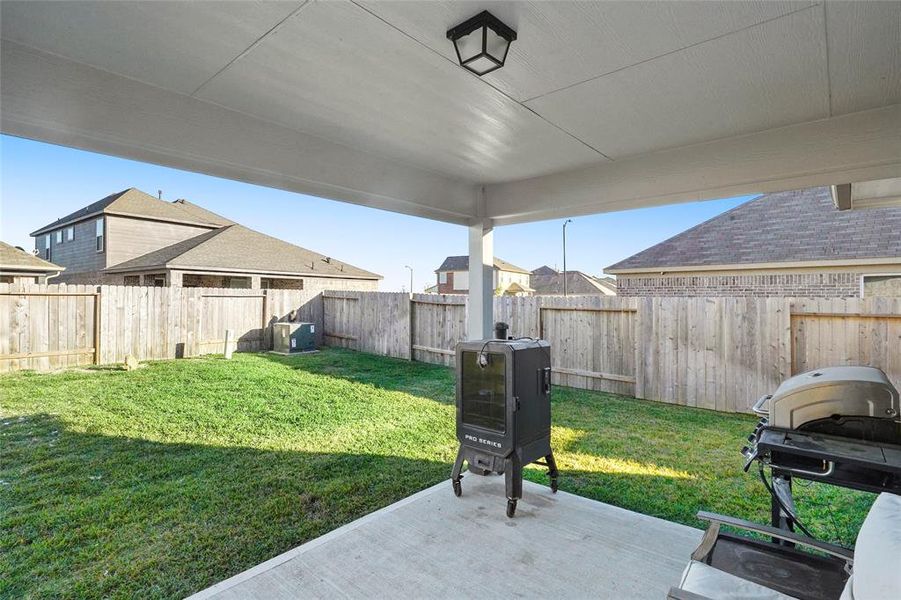 The covered back patio is the perfect place to sip your morning coffee!