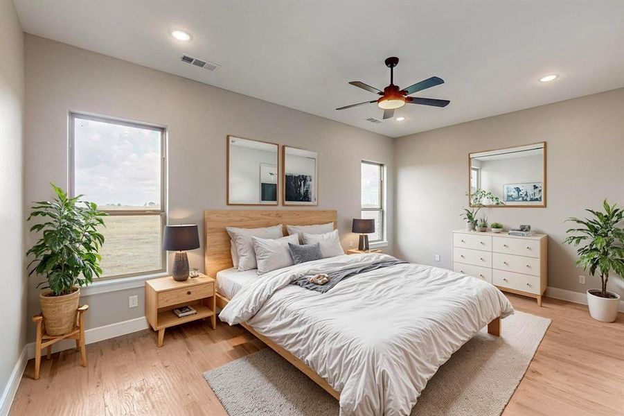 Virtual Main Bedroom featuring light hardwood / wood-style floors and ceiling fan