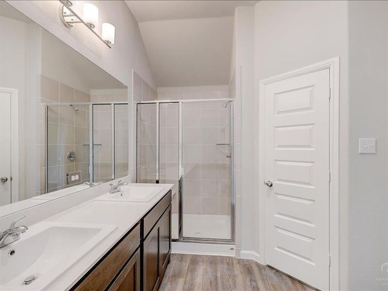 Primary Bathroom in the Amber home plan by Trophy Signature Homes – REPRESENTATIVE PHOTO