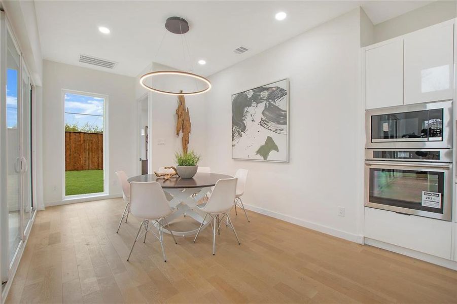 Unfurnished dining area with light wood-type flooring