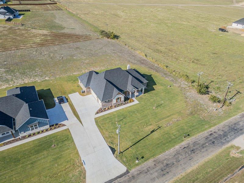 Birds eye view of property with a rural view