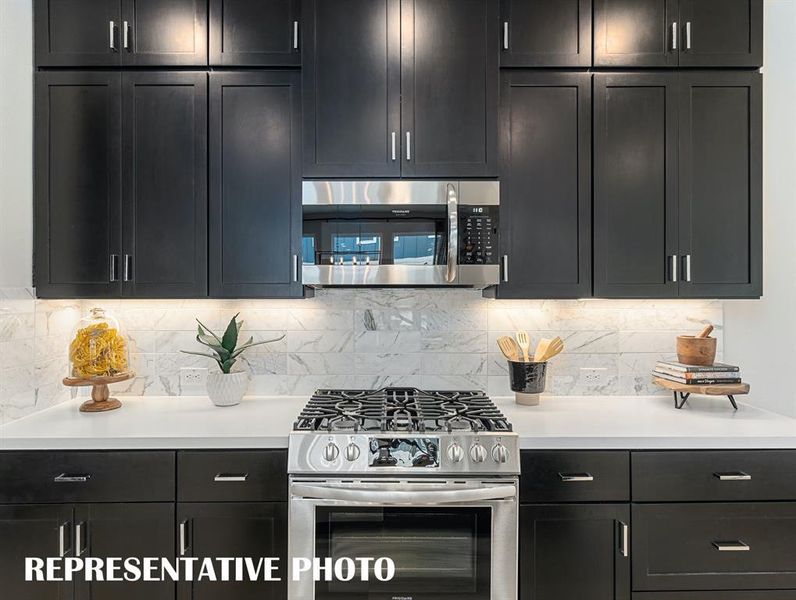 Classic finishes, beautiful cabinetry and fantastic space...any chef would be proud to call this kitchen their own!  REPRESENTATIVE PHOTO