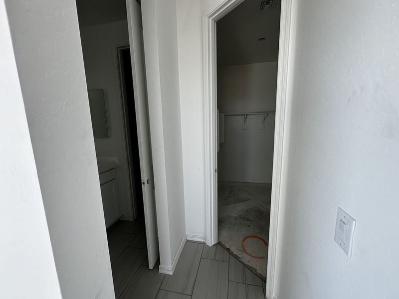 Primary suite bathroom and walk in closet