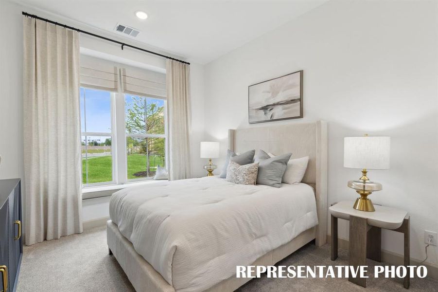 You'll find nicely sized secondary bedrooms in our Madeleine floor plan.  REPRESENTATIVE PHOTO