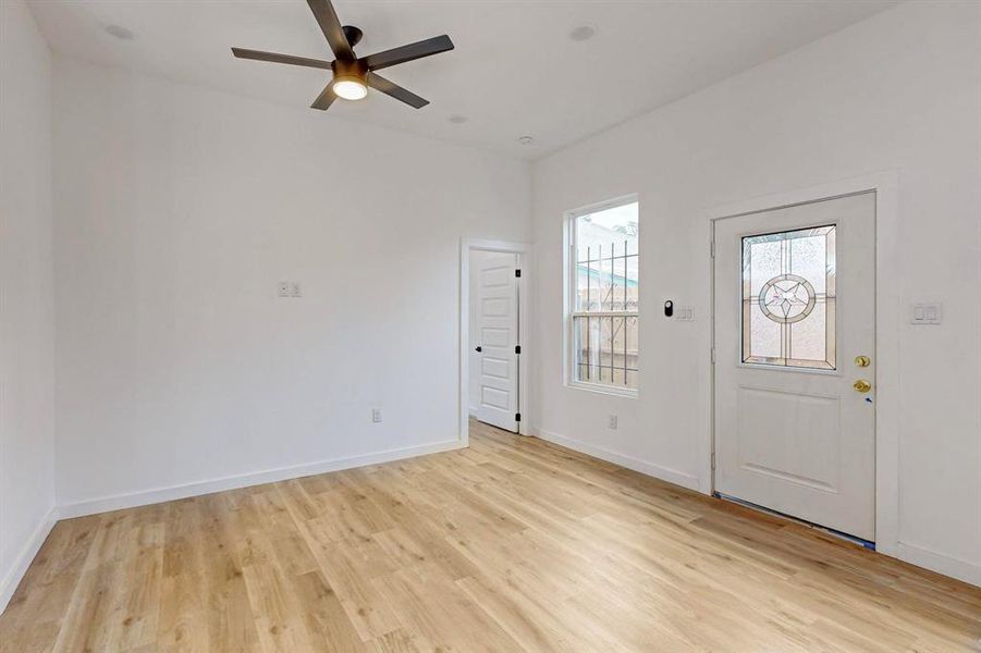 Foyer featuring ceiling fan and light wood-type flooring