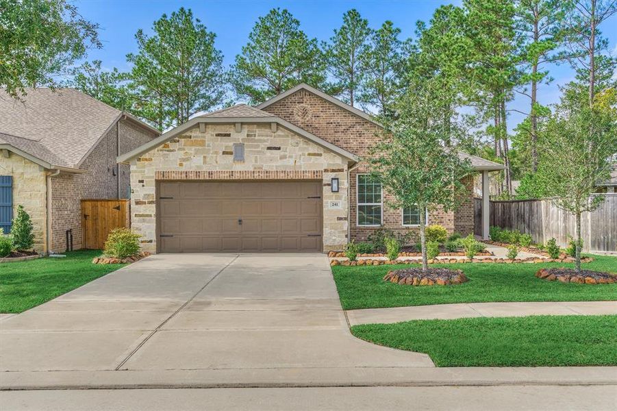 Charming brick and stone elevation in this beauty in coveted Bonterra at Woodforest!