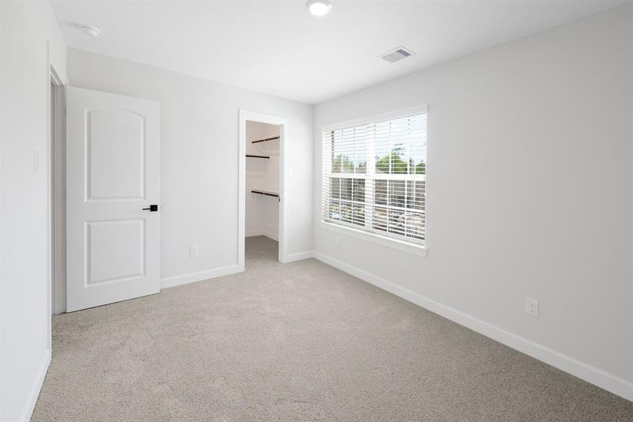 As you can see, this secondary upstairs bedroom is spacious and has a large multi-functional closet.