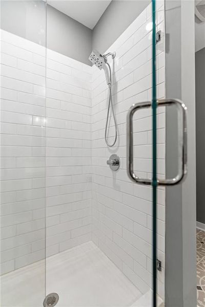 Tiled shower with frameless glass