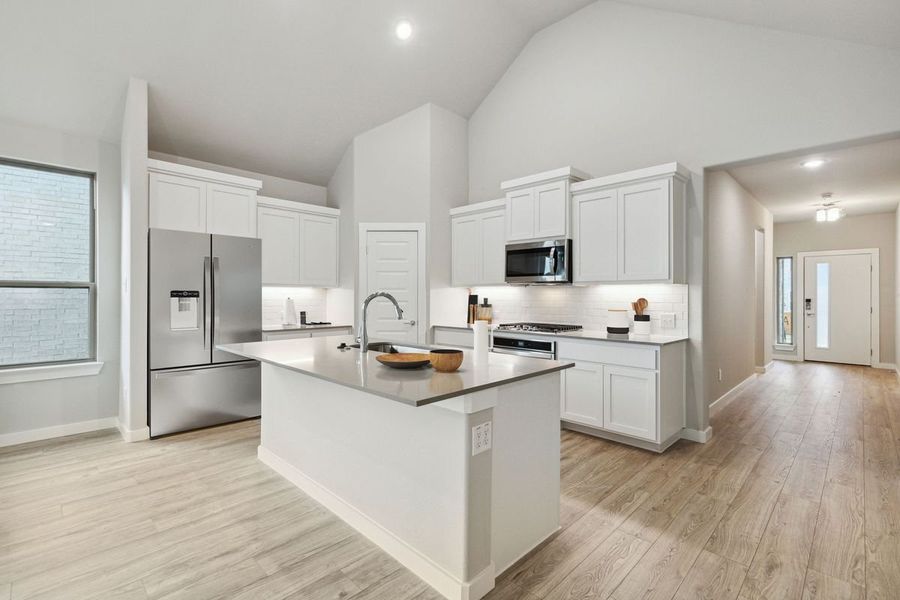 Kitchen in the Claret home plan by Trophy Signature Homes – REPRESENTATIVE PHOTO